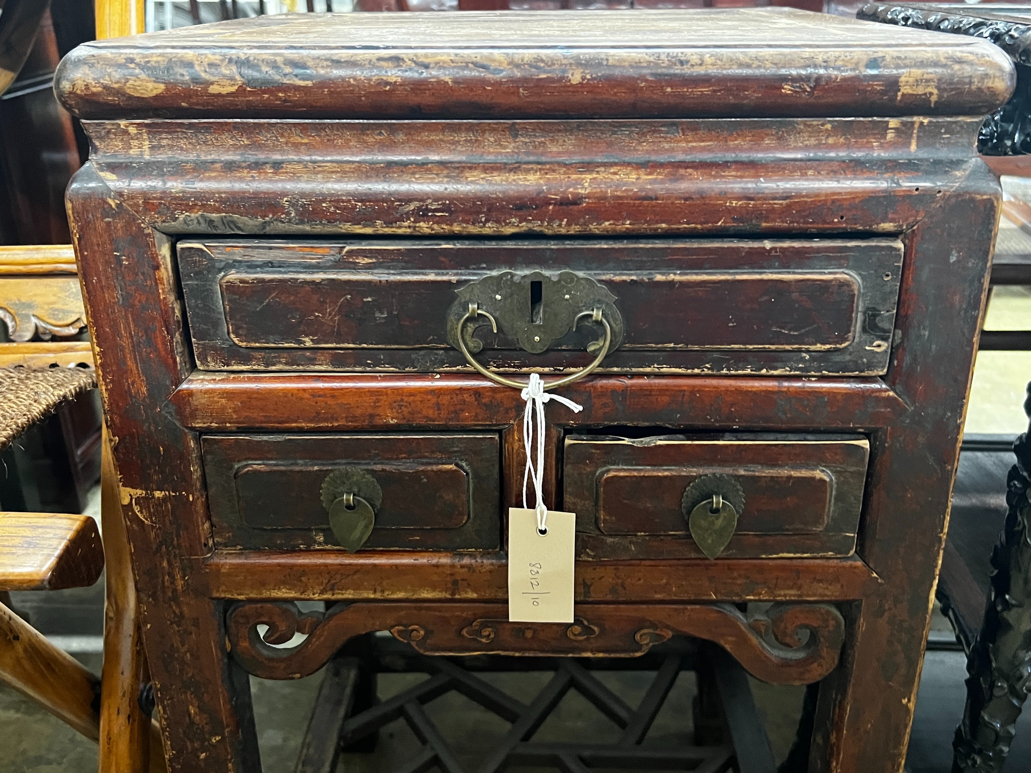 A Chinese lacquered wood three drawer side table, width 43cm, depth 44cm, height 77cm